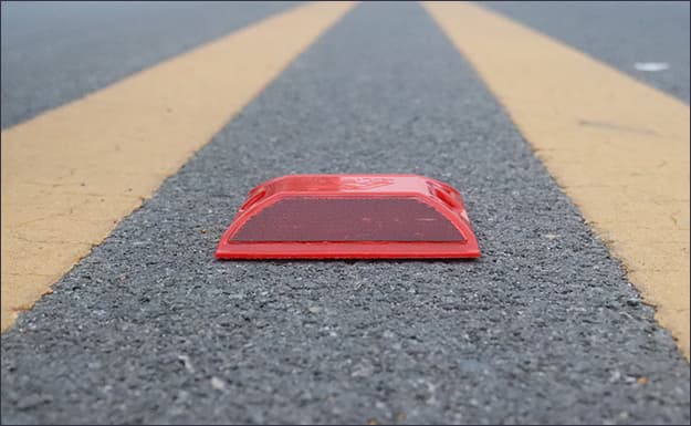 reflective cat eye on road